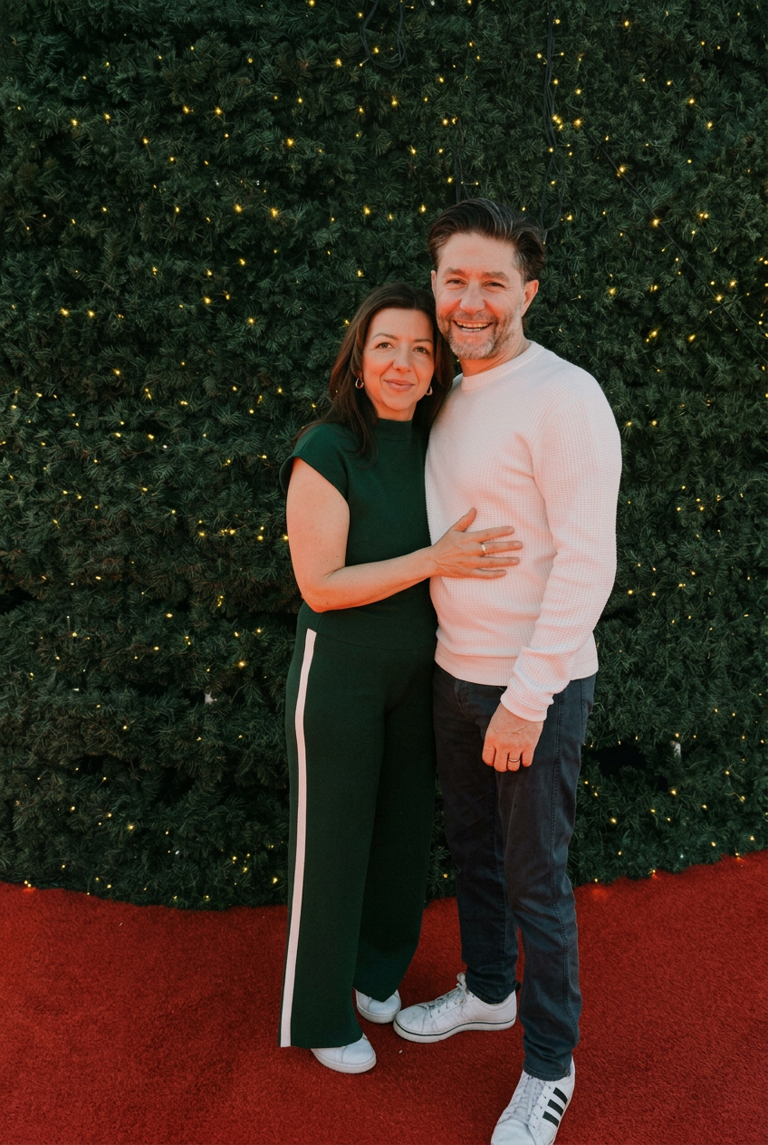 A midlife couple feeling close again on a sofa